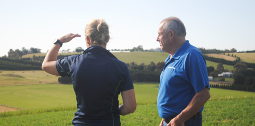A PGG Wrightson Seeds agronomist talks with a farmer in a paddock